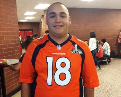 Junior, Jesus Torres wearing a Peyton Manning jersey (Briana Garcia)