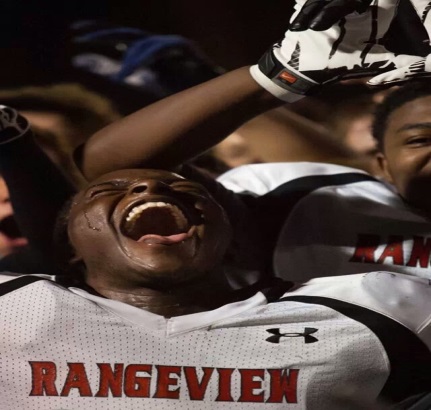 Senior Dom Smith reacts after a win his junior year in football. (Aurora Sentinel) 