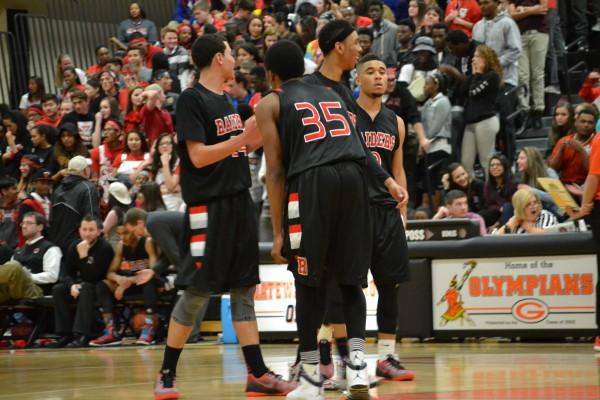 Seniors Tim Wyatt, Jalen Davis, and Tarren Storey-Way talk back on February 20th against Gateway. (Briana Garcia) 