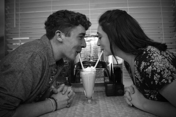 Danyion Reagan and Maddie Heiken, both juniors, get to know each other over a milkshake. Even with just friends, a milkshake date can be a great way to spend some quality time together. (Izzy Honey) 