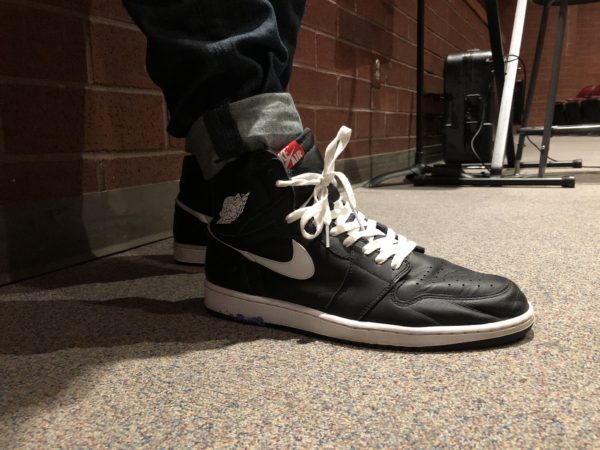 Feature Photo By: Yucheng Zhang - Senior Spencer Reagan showing off his Jordan 1s.  Reagan enjoys these particular shoes immensely, and plans to utilize them throughout the fall.