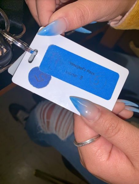 Adeleen Quiroz holds her principals pass. “I’m not always asked for my pass, so I guess, at the moment, they seem kind of pointless.” 