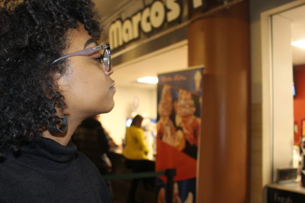 Ariana Jones waits at the food stand at the Michelle Obama Book Tour in Denver, this is a lifetime opportunity, said Jones. 