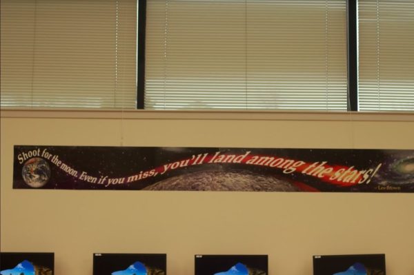  A poster reading, “Shoot for the moon. Even you if you miss, you’ll land among the stars,” immediately catches the eye as one walks into Mr. Brown's room, motivating students and keeping to a space theme around his room (Elliston) .