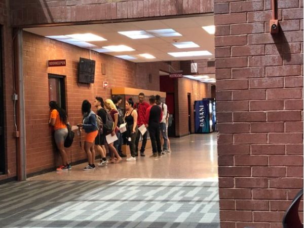 Featured Photo by: VeThalia Warren - Seniors line up while they get their check out sheets approved and stamped by the bookkeeper during 6th period.Senior Zahla Neal-colemen exclaims,” I just feel really excited and happy but I’m also very sad. Im happy because this means Im going to start the next chapter of my life, going off to college and being on my own. But I’m very sad because this means that I’m leaving all my juniors, sophomores, and freshmen friends behind.”