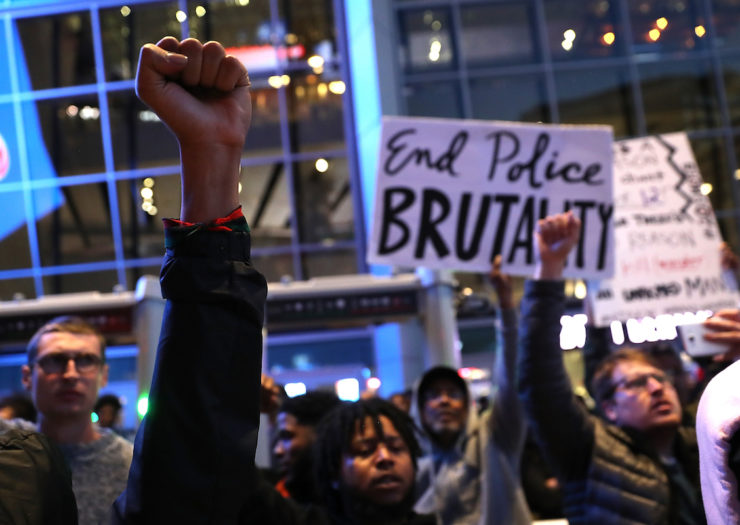 The picture showcases a protest against police brutality. (Rewire.News)