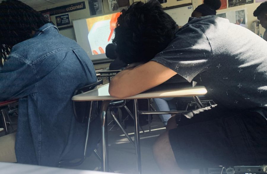 Sophomore Josh Alvarez is seen resting his head while watching a video during his history class; school has only been in session for a month and a half, and students are already tired (Joslyn Bowman).