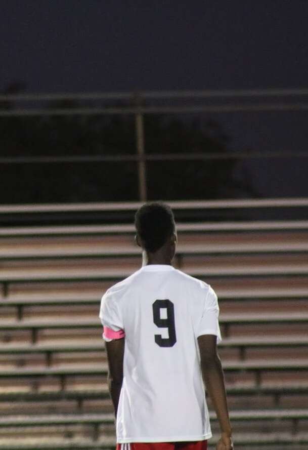Rashid Seidu-Aroza looks towards the stands as he catches his breath.