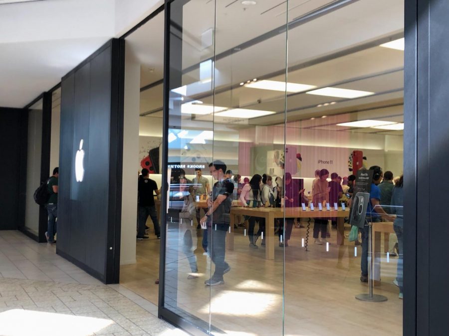 The Apple store in the Cherry Creek mall is filled with awaiting customers looking at the many products they sell. (Stephanie Pickens)
