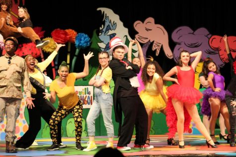 The cast of Seussical performs on stage. The Whos, Cat in the Hat, Jojo, the birds, and other various characters dance and sing to one of the songs. (Alexis Drummond)