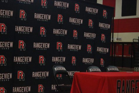 Rangeview athletes along with their family and friends are eager to capture the moment in front of the Rangeview banner (Jeffrey Afriyie).