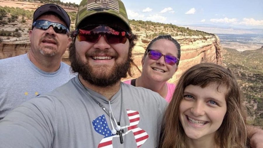 Feature Photo by Fox 7 Austin: The Lyster family smiles for a picture during a hike.
