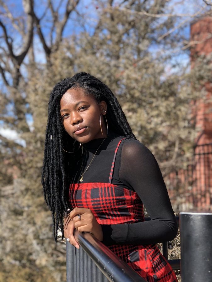 Salmata poses for a photo that captures the best lighting at the signature photo spot for most Rangeview seniors. This is her last photo taken on Rangeviews campus. (Salmata Soulemane)