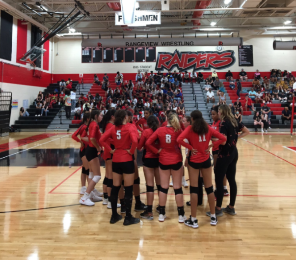 Rangeview Girls Volleyball meets in a huddle in game vs Thomas Jefferson High School on August 31, 2021.