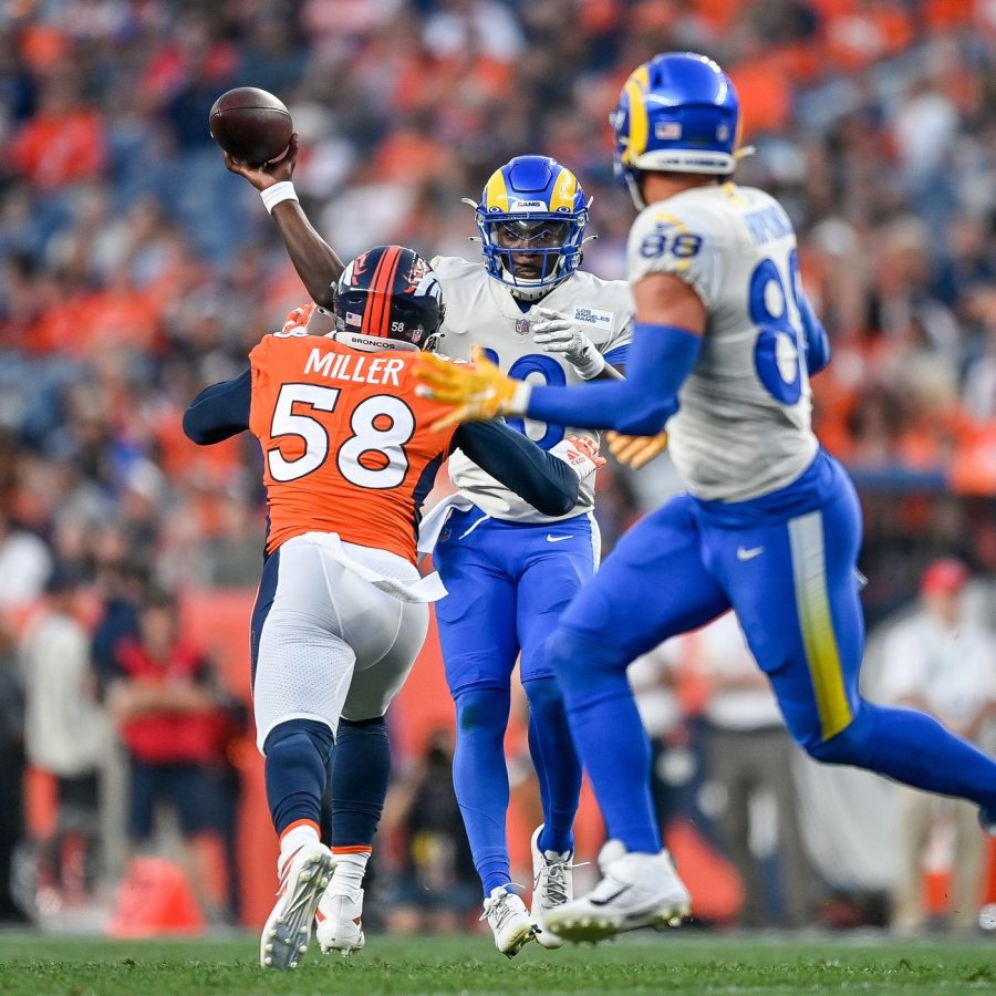 Von Miller puts pressure on Los Angeles Rams Quarterback Bryce Perkins as he throws to Rams Tight End Brycen Hopkins. (Timothy A. Clary)
