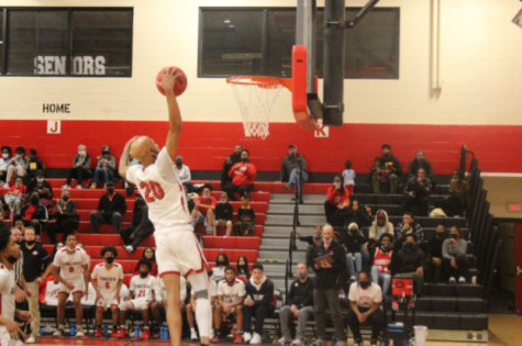 Rangeview Raiders Center KK Stroter attempts a fastbreak dunk in win against Overland on 12/9. (Joslyn Bowman, Raider Review)