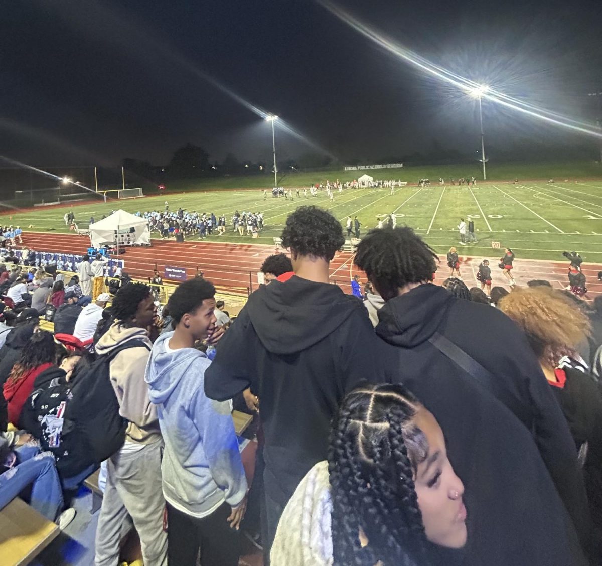 Students watch the Vista Peak and Rangeview football game before the game was cancelled in the 3rd quarter.