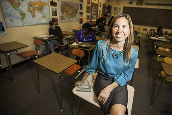 Amanda Westenberg takes a quick break between classes to smile for the camera, Dec. 14 at Rangeview High School. Westenberg was named the 2013 Colorado Teacher of the Year.  (Marla R. Keown/Aurora Sentinel)