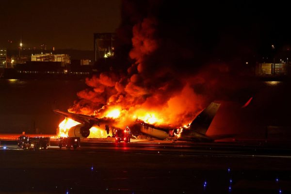 Plane JAL-516 on fire after crash. Credit to CNN for the picture.